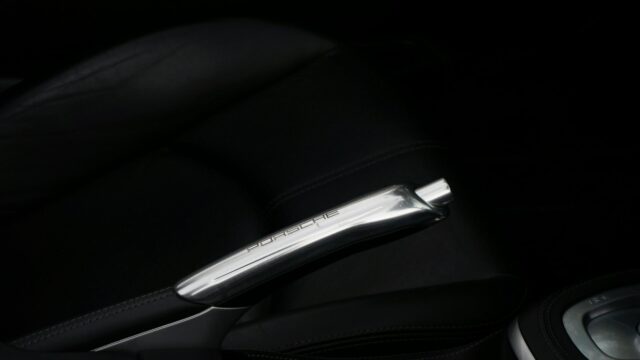 Elegant Porsche Metallic Handbrake Interior Close-up 4K Wallpaper