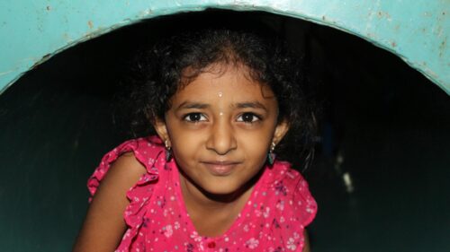 Close-up Portrait of a Young Girl in Pink Dress Desktop Wallpaper