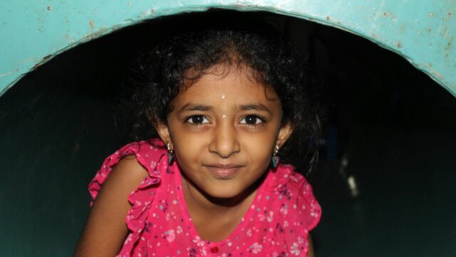 Close-up Portrait of a Young Girl in Pink Dress Desktop Wallpaper