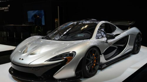 Silver McLaren P1 Supercar Showroom Display 4K Desktop Wallpaper