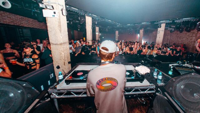 DJ Performing for an Electric Crowd at an Underground Nightclub 4K Wallpaper