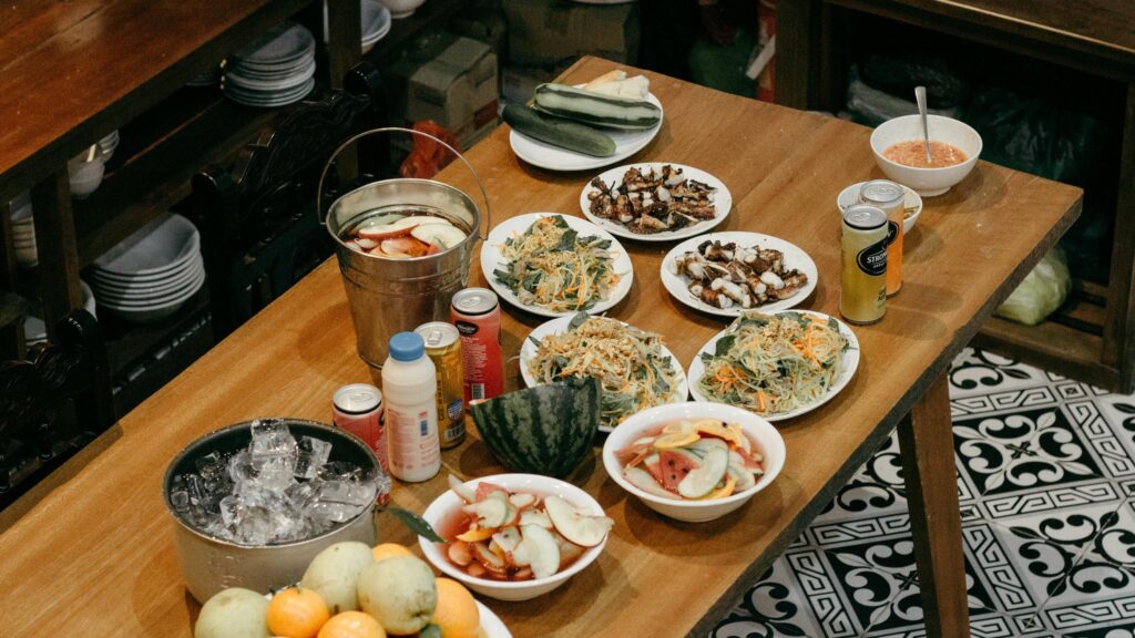 Festive Dining Table Spread with Food and Drinks Desktop Wallpaper