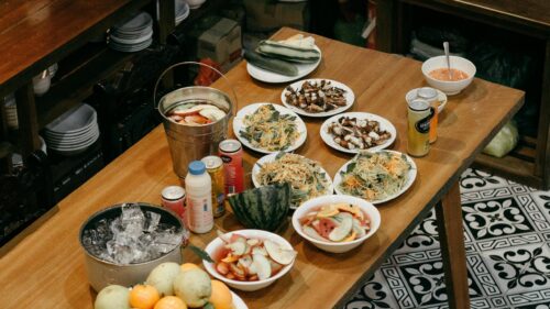 Festive Dining Table Spread with Food and Drinks Desktop Wallpaper