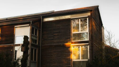 Rustic Wooden House at Golden Hour Scenic Architectural 4K Wallpaper