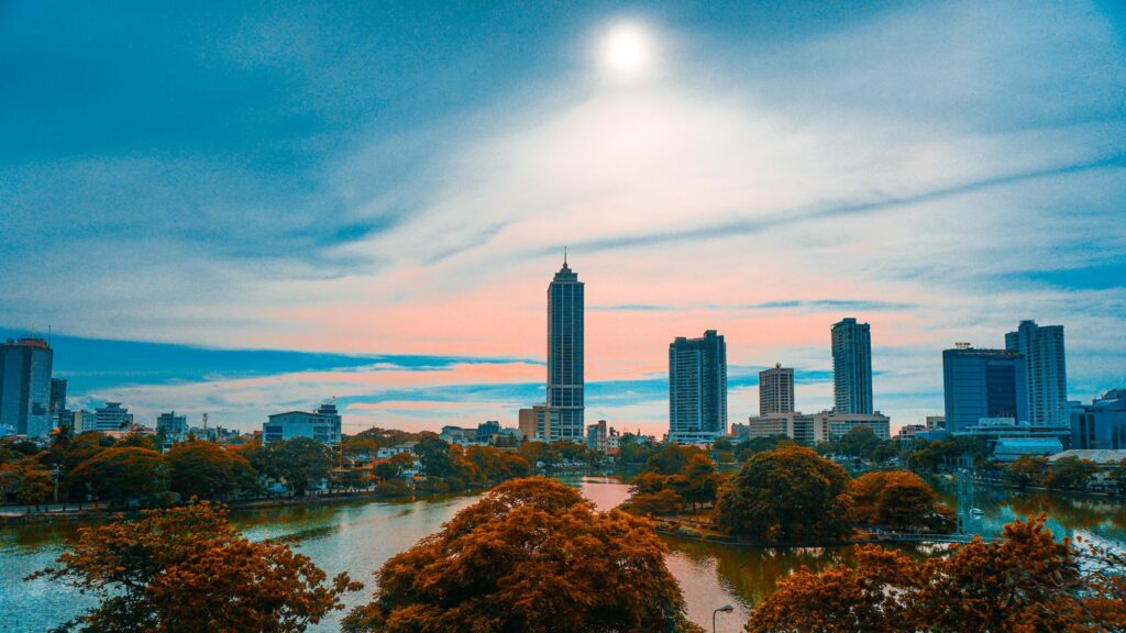 Stunning Colombo Skyline at Sunset Over Beira Lake 4K Wallpaper