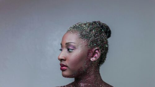 Stunning Artistic Portrait of Woman with Glitter Makeup 4K Wallpaper
