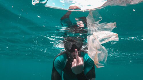 Diver Expressing Disgust at Ocean Plastic Pollution 4K Wallpaper