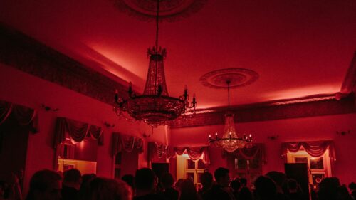 Elegant Ballroom Under Red Party Lighting 4K Desktop Wallpaper