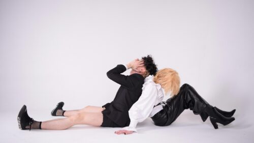 Androgynous Fashion Duo Posing Back to Back 4K Desktop Wallpaper