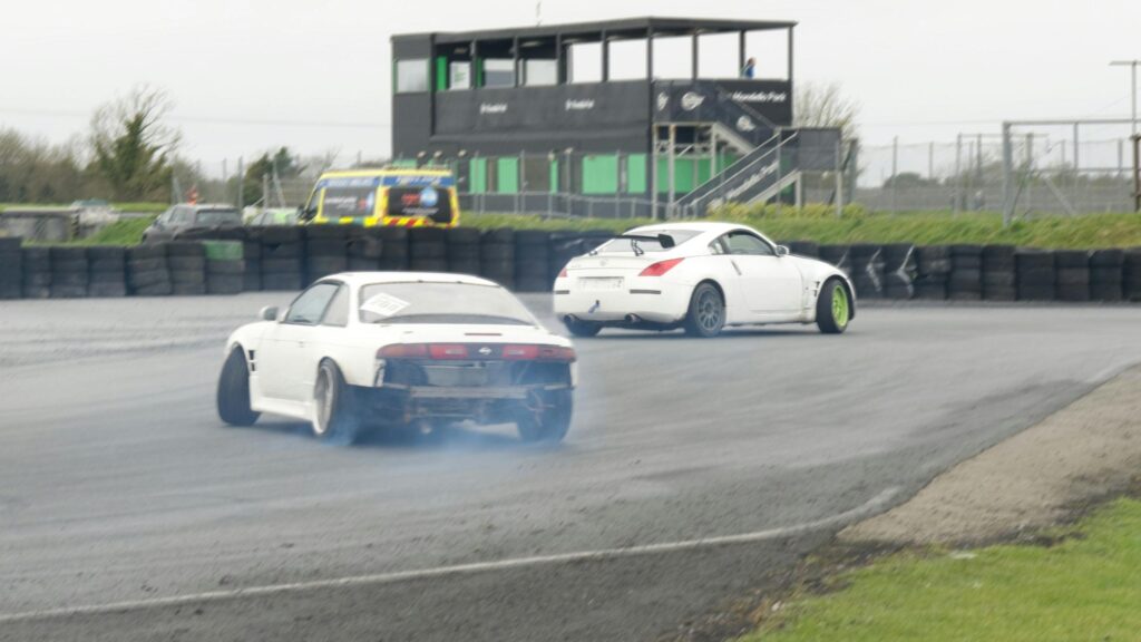 Drifting White Nissan JDM Sports Cars on Track 4K Desktop Wallpaper