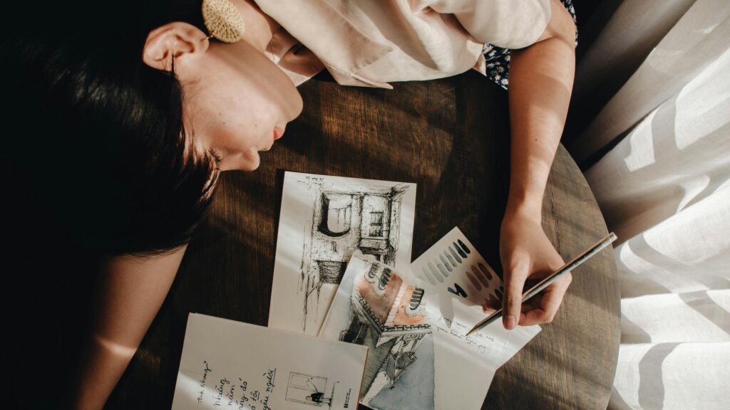 Artist Drawing at Sunset Desk Aesthetic 4K Desktop Wallpaper