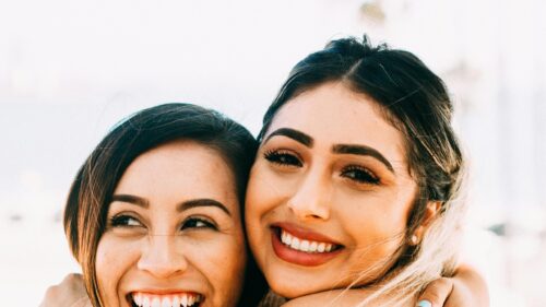 Two Happy Friends Smiling Close Up Portrait 4K Wallpaper