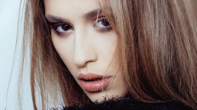 Stunning Close Up Portrait of a Beautiful Woman with Long Hair 4K Wallpaper