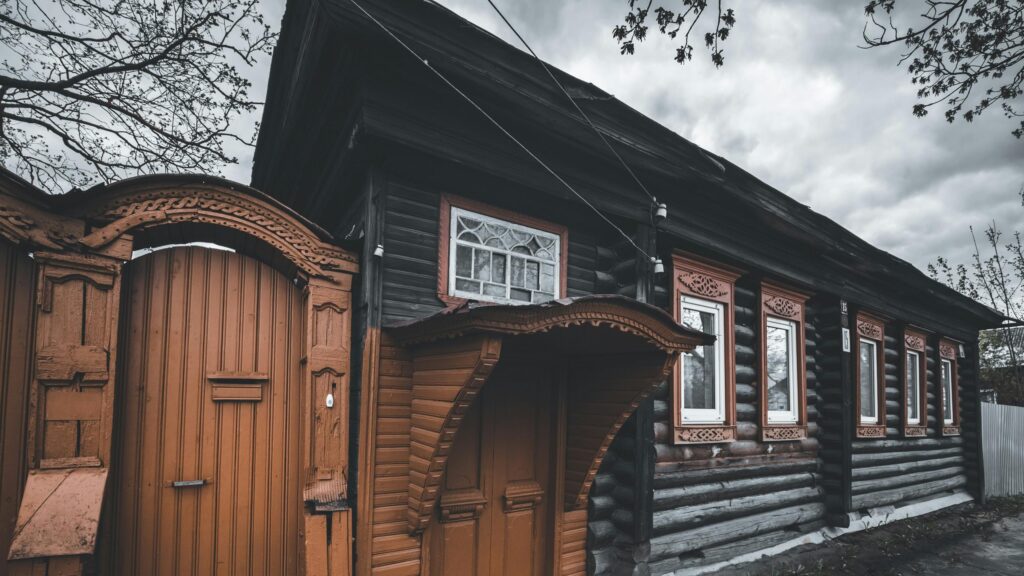 Rustic Wooden House with Traditional Russian Architecture Desktop Wallpaper