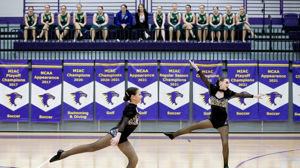 Two Dancers Performing Dynamic Choreography on Court Desktop Wallpaper