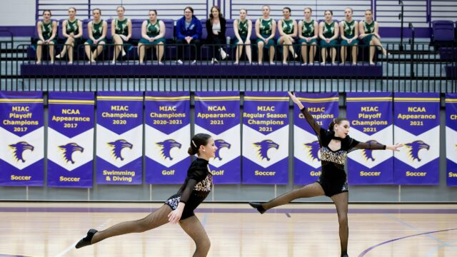 Two Dancers Performing Dynamic Choreography on Court Desktop Wallpaper