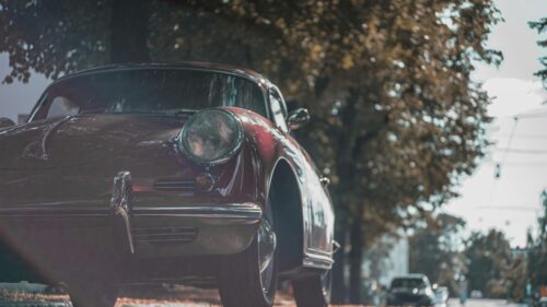 Vintage Maroon Porsche 356 Parked Under Autumn Trees 4K Wallpaper