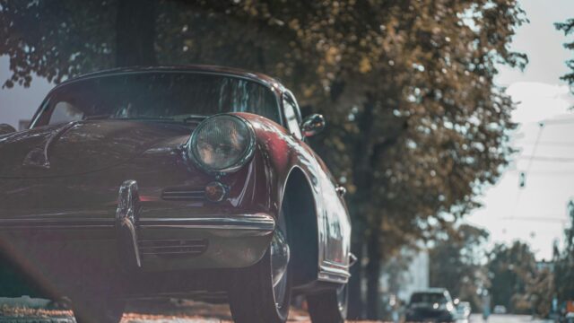 Vintage Maroon Porsche 356 Parked Under Autumn Trees 4K Wallpaper
