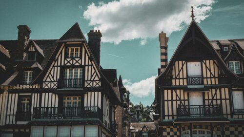 Charming Timbered Tudor Houses under Blue Summer Sky Desktop Wallpaper