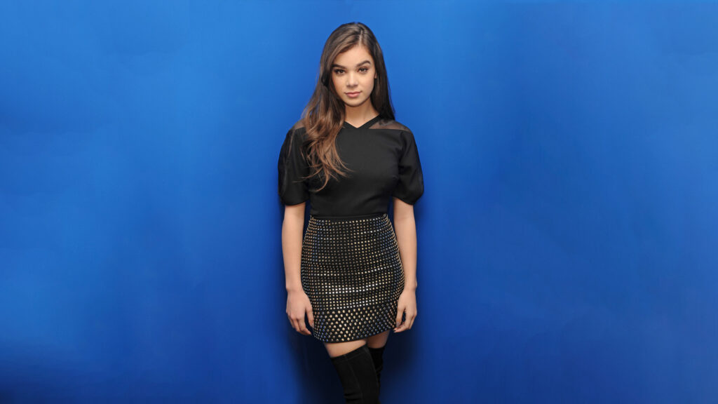 Hailee Steinfeld Stunning Portrait Against Vibrant Blue Background 4K Wallpaper