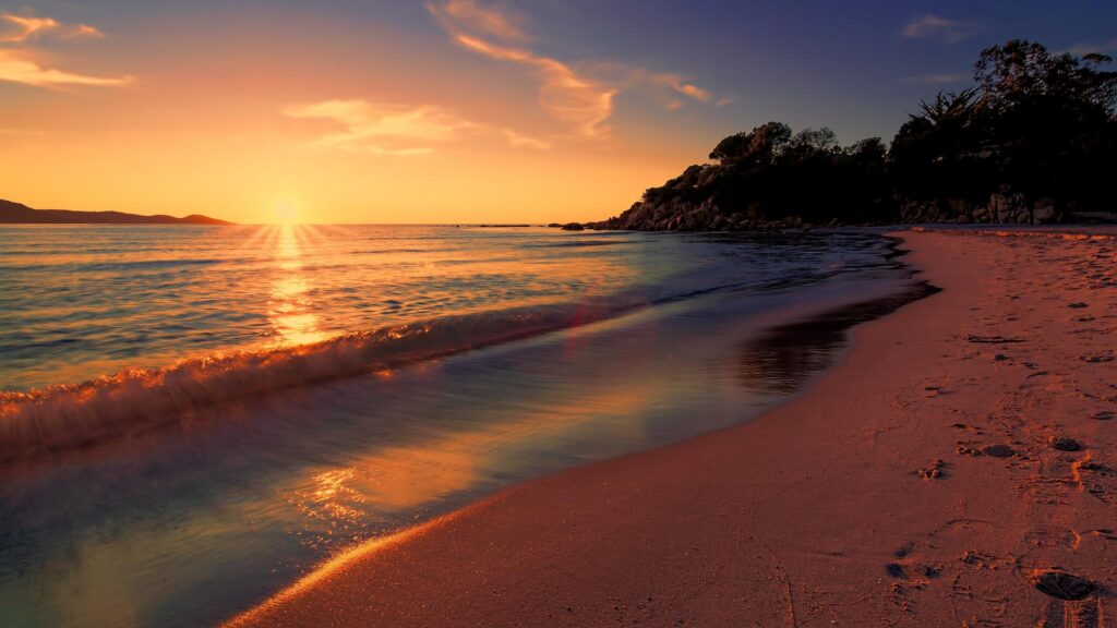 Stunning Golden Hour Tropical Beach Sunset with Calm Waves Desktop Wallpaper