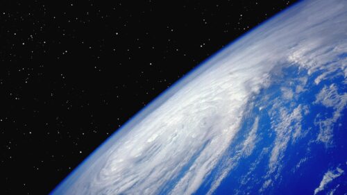 Stunning Earth Horizon View from Space with Swirling Clouds 4K Wallpaper