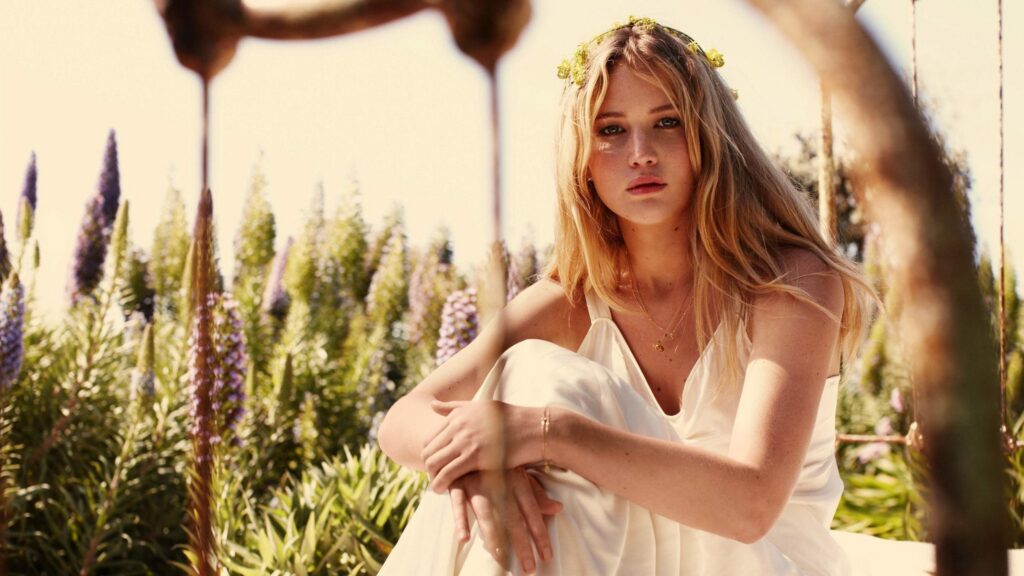Jennifer Lawrence in a White Summer Dress Amidst Wildflowers Desktop Wallpaper