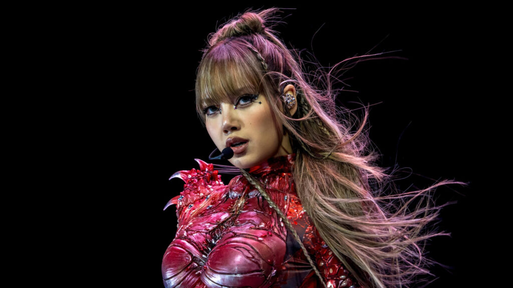Stunning Lisa Blackpink Performance in Red Avant-Garde Outfit 4K Desktop Wallpaper