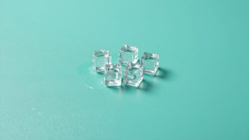 Minimalist Ice Cubes on Mint Green Background 4K Wallpaper