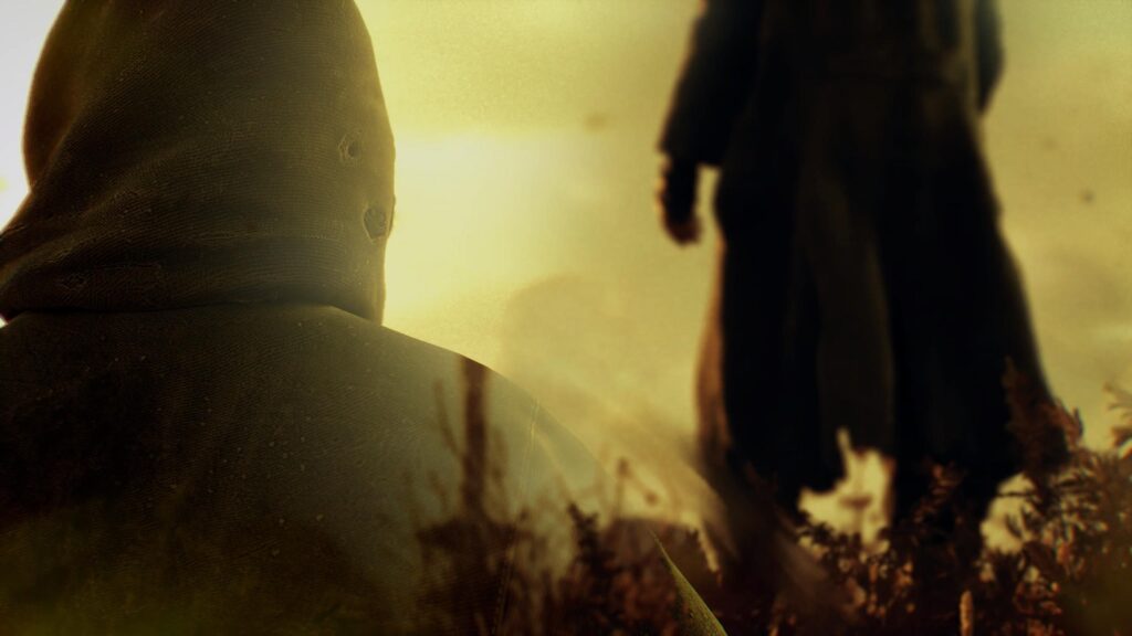Mysterious Cloaked Figure in Golden Haze Cinematic Desktop Wallpaper