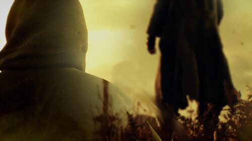 Mysterious Cloaked Figure in Golden Haze Cinematic Desktop Wallpaper
