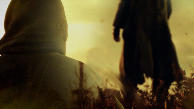 Mysterious Cloaked Figure in Golden Haze Cinematic Desktop Wallpaper