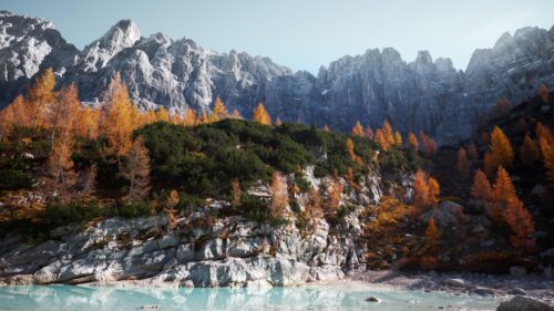 Breathtaking Alpine Lake with Autumn Larches and Jagged Peaks Desktop Wallpaper