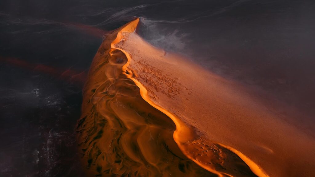 Stunning Aerial View of Golden Sand Dunes at Sunset 4K Wallpaper