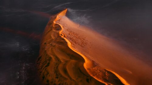 Stunning Aerial View of Golden Sand Dunes at Sunset 4K Wallpaper