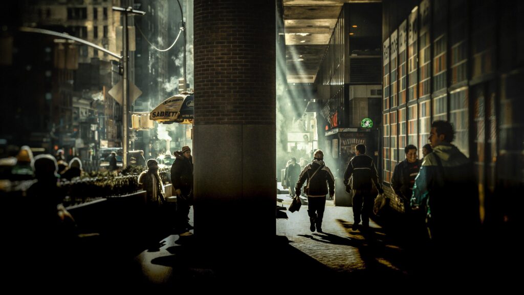 Cinematic New York City Street Scene with Dramatic Sunlight and Steam 4K Desktop Wallpaper