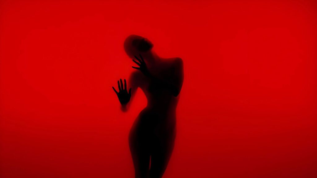 Abstract Silhouette of a Woman Behind Red Glass Desktop Wallpaper