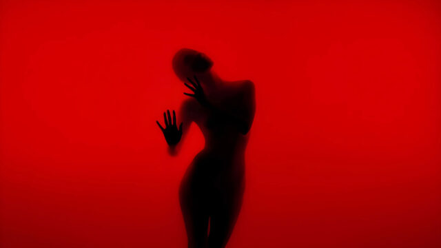 Abstract Silhouette of a Woman Behind Red Glass Desktop Wallpaper