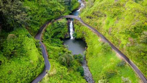 Aerial View of Scenic Road Over Waterfall and Tropical Forest PC Wallpaper