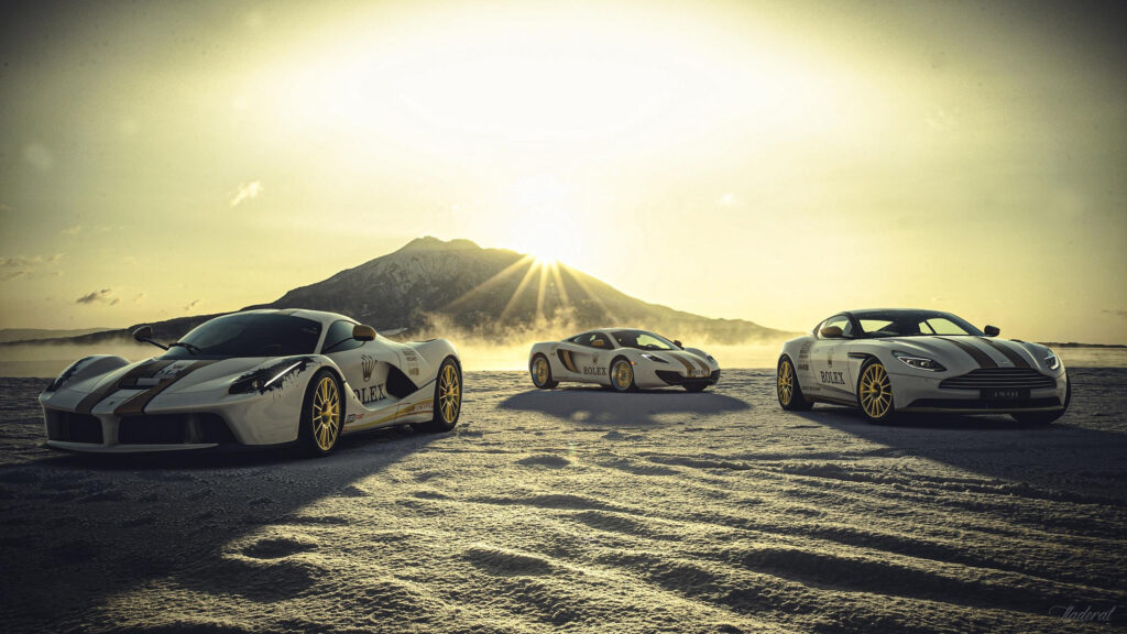 Stunning Trio of Rolex Edition Luxury Sports Cars on Snowy Landscape 4K Wallpaper