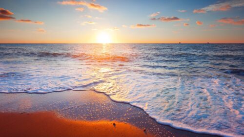 Golden Hour Sunset Over Tropical Ocean Beach 4K Desktop Wallpaper