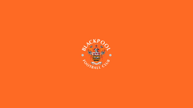Blackpool Football Club Logo on Vibrant Orange Background Desktop Wallpaper