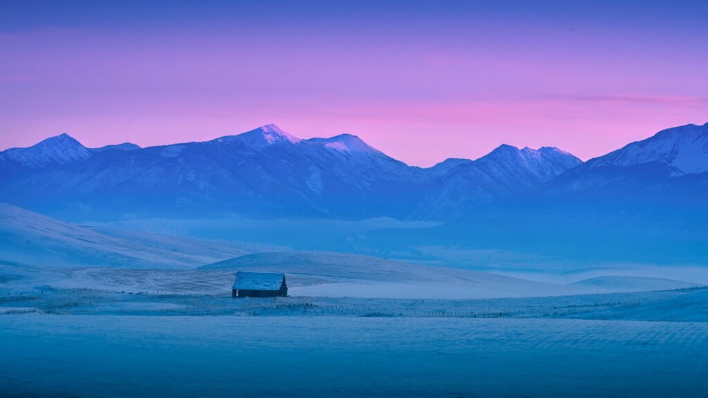 Lonely Barn in Snowy Mountains at Sunset Serene Landscape Desktop Wallpaper