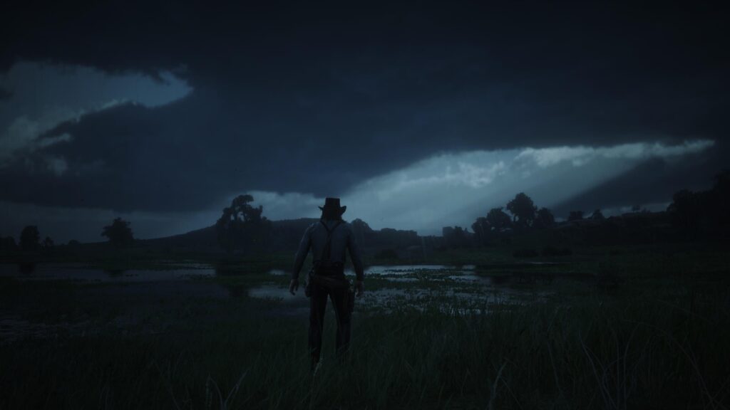 Arthur Morgan Standing in Stormy Wetlands Red Dead Redemption 2 4K Desktop Wallpaper