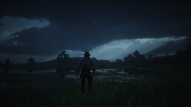 Arthur Morgan Standing in Stormy Wetlands Red Dead Redemption 2 4K Desktop Wallpaper