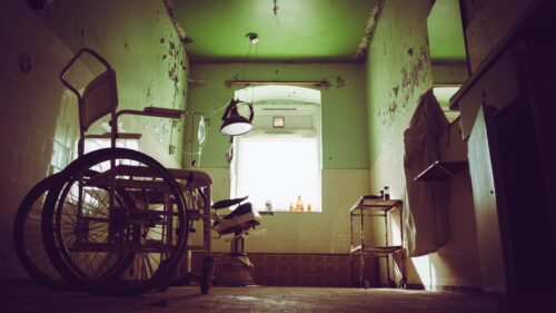 Abandoned Hospital Room with Wheelchair and Medical Equipment 4K Wallpaper